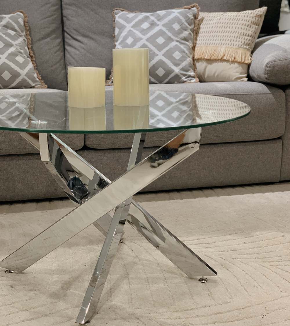 Mesa centro de cristal redonda DAN con patas cruzadas